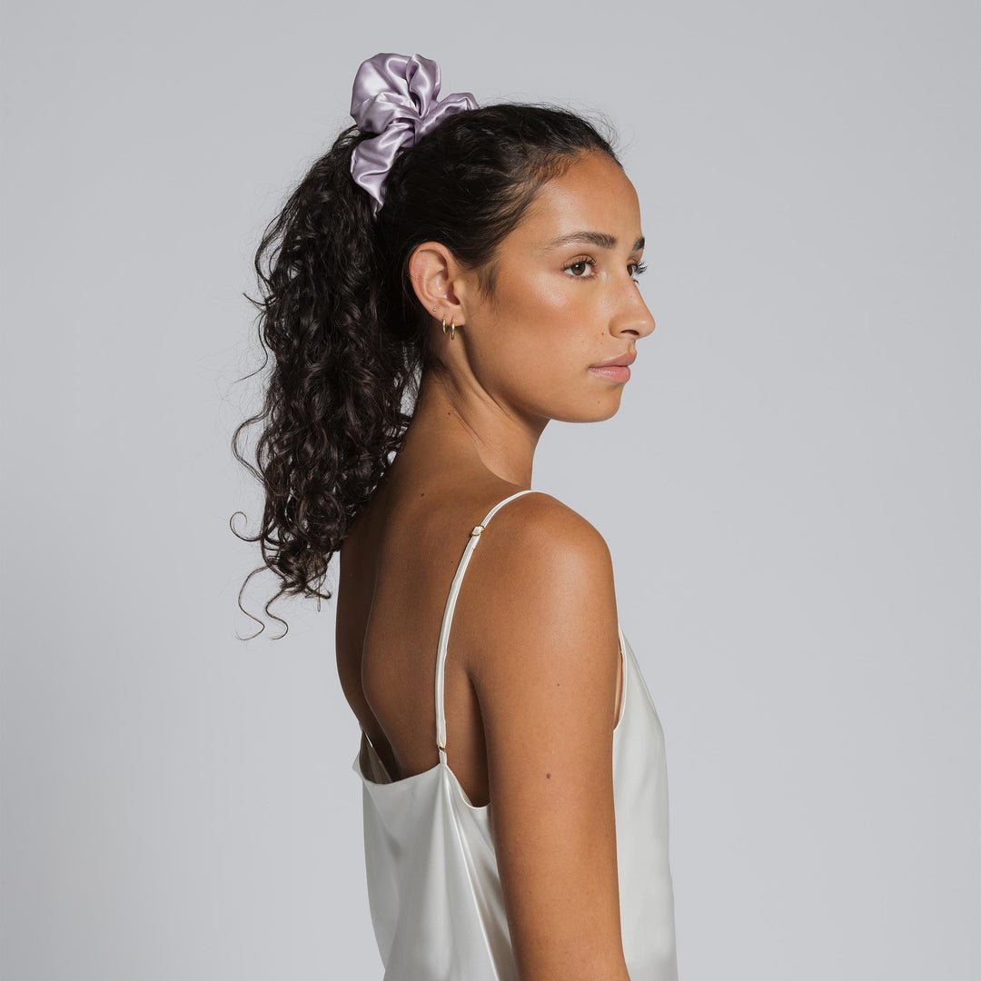 lilac scrunchie in dark curly hair