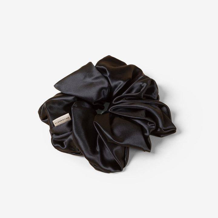 Black silk scrunchie with "CLEMENTINE" fabric label