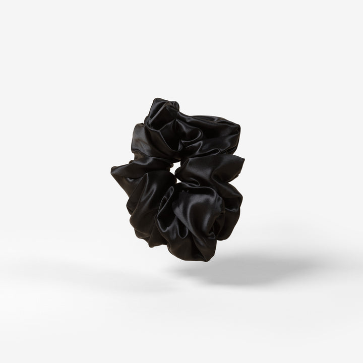 black scrunchie floating