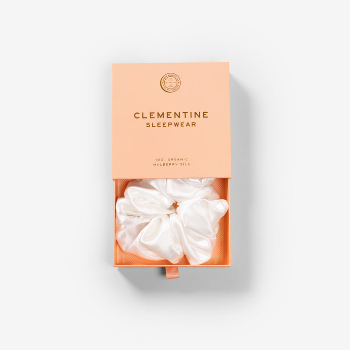 CLEMENTINE SLEEPWEAR gift box with white silk scrunchie — box reads 'CLEMENTINE SLEEPWEAR 100% ORGANIC MULBERRY SILK'