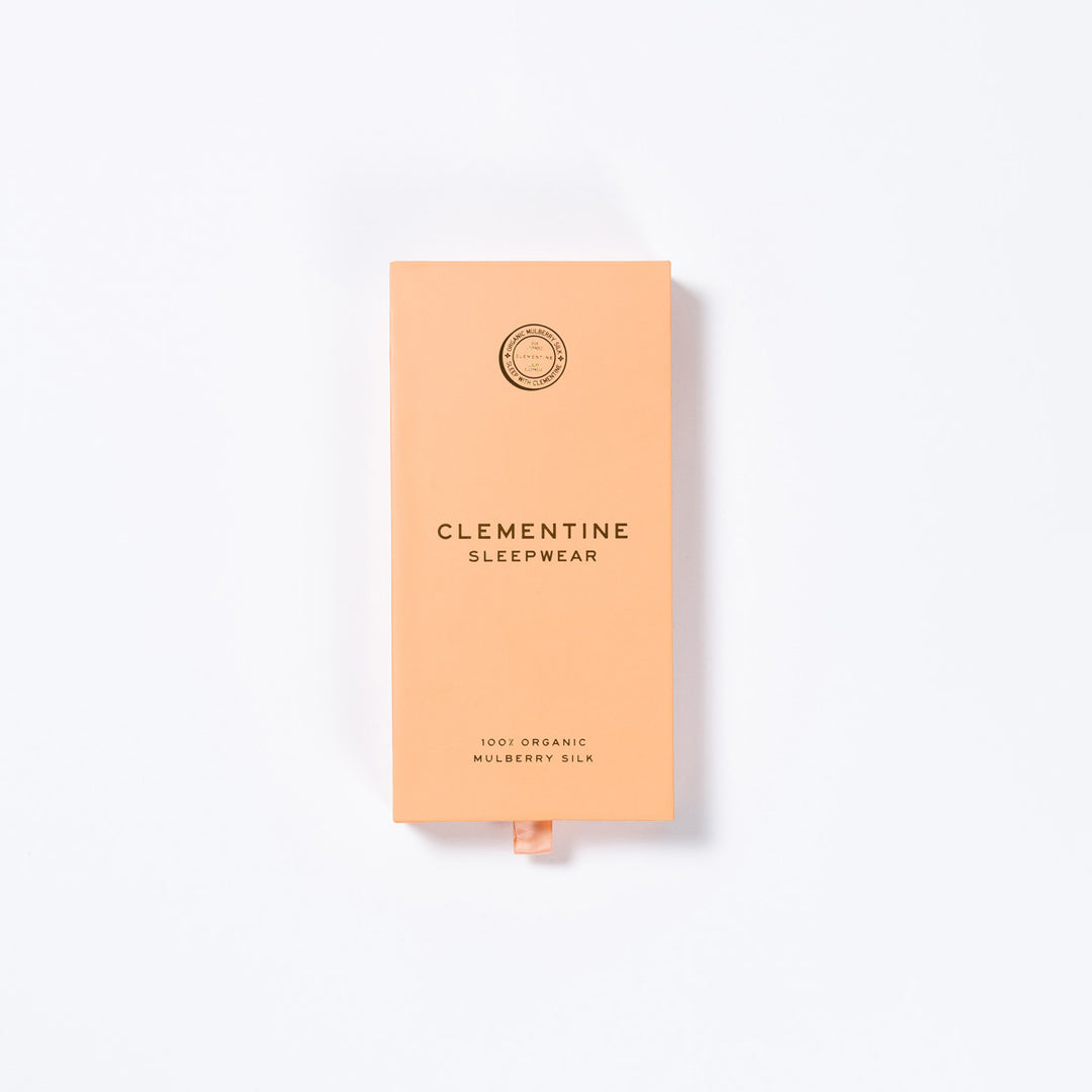 Peach gift box labeled CLEMENTINE SLEEPWEAR; also reads 100% ORGANIC MULBERRY SILK.#color_lilac-haze