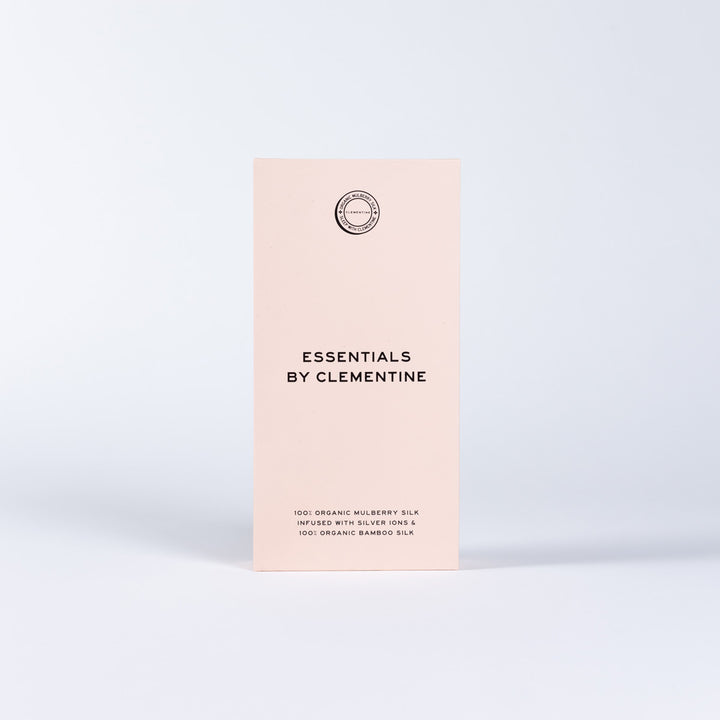 Pale pink upright box labeled 'ESSENTIALS BY CLEMENTINE' with small organic silk copy at the bottom. - #color_match-point-green