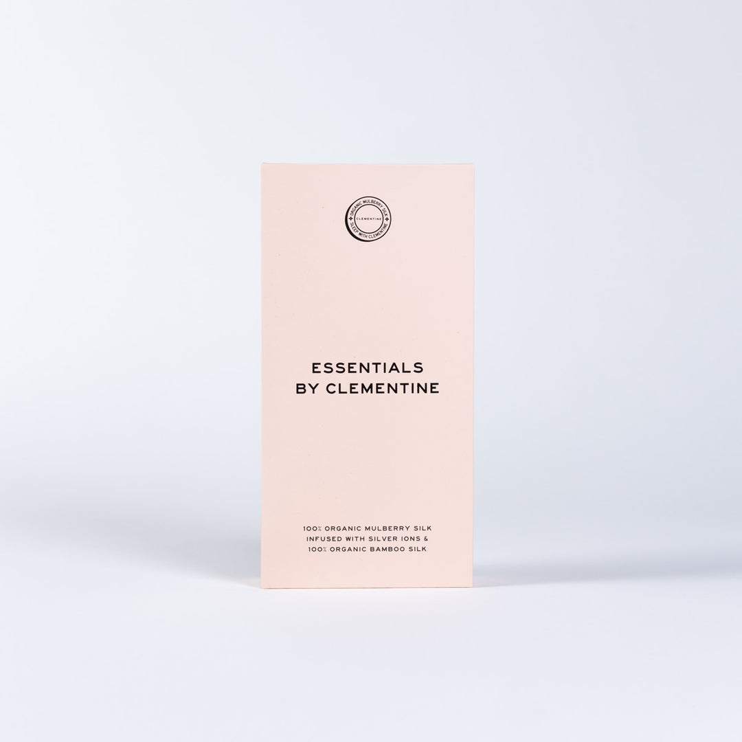 'ESSENTIALS BY CLEMENTINE' on pink box; '100% ORGANIC MULBERRY SILK INFUSED WITH SILVER IONS & 100% ORGANIC BAMBOO SILK' - #color_champagne-sunset