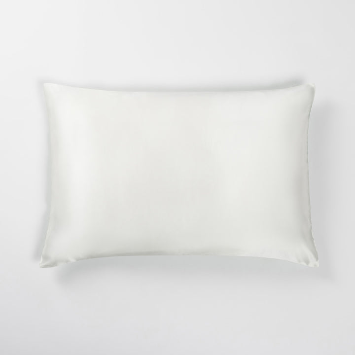 White rectangular pillow with stitched edges on a light neutral background - #color_match-point-green