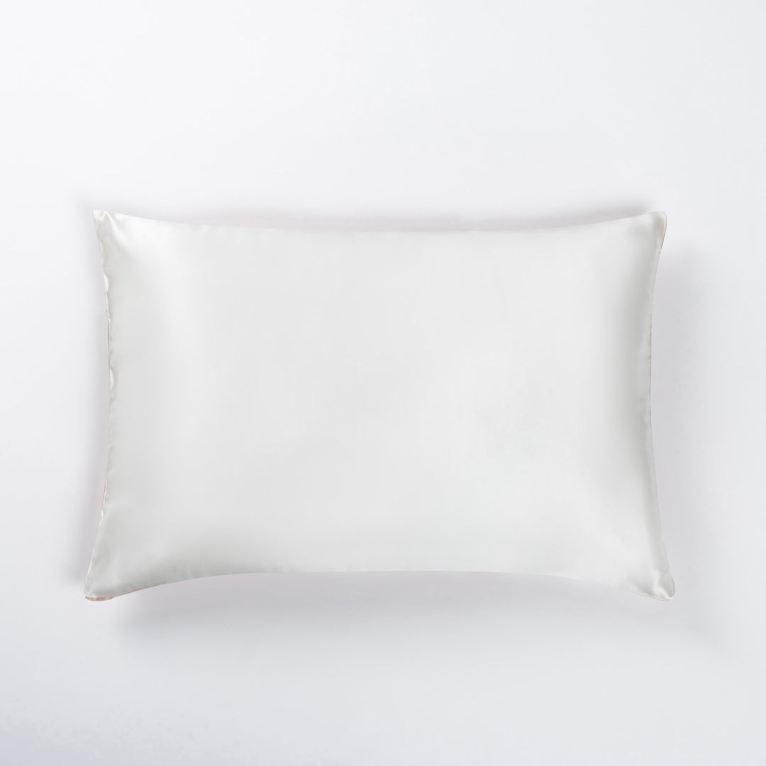 white silk pillowcase with piped edges, photographed flat against a white background - #color_ballet-pink