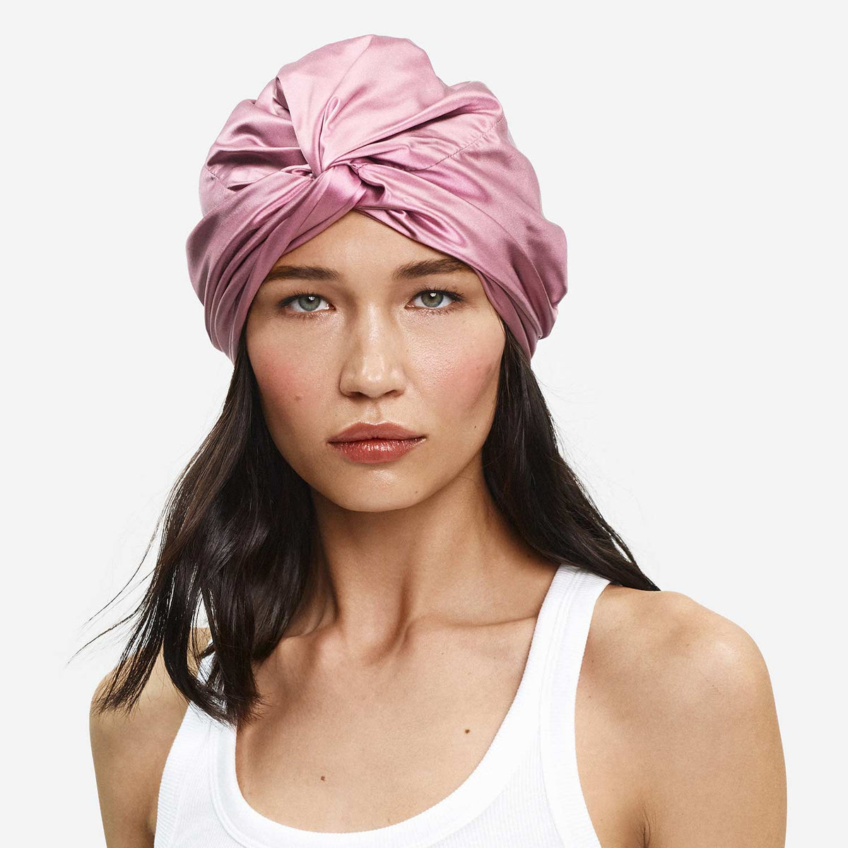 Front view of Organic Silk Hair Bonnet on model showing twisted knot front, smooth silk finish, and rose pink color against white background #color_crush