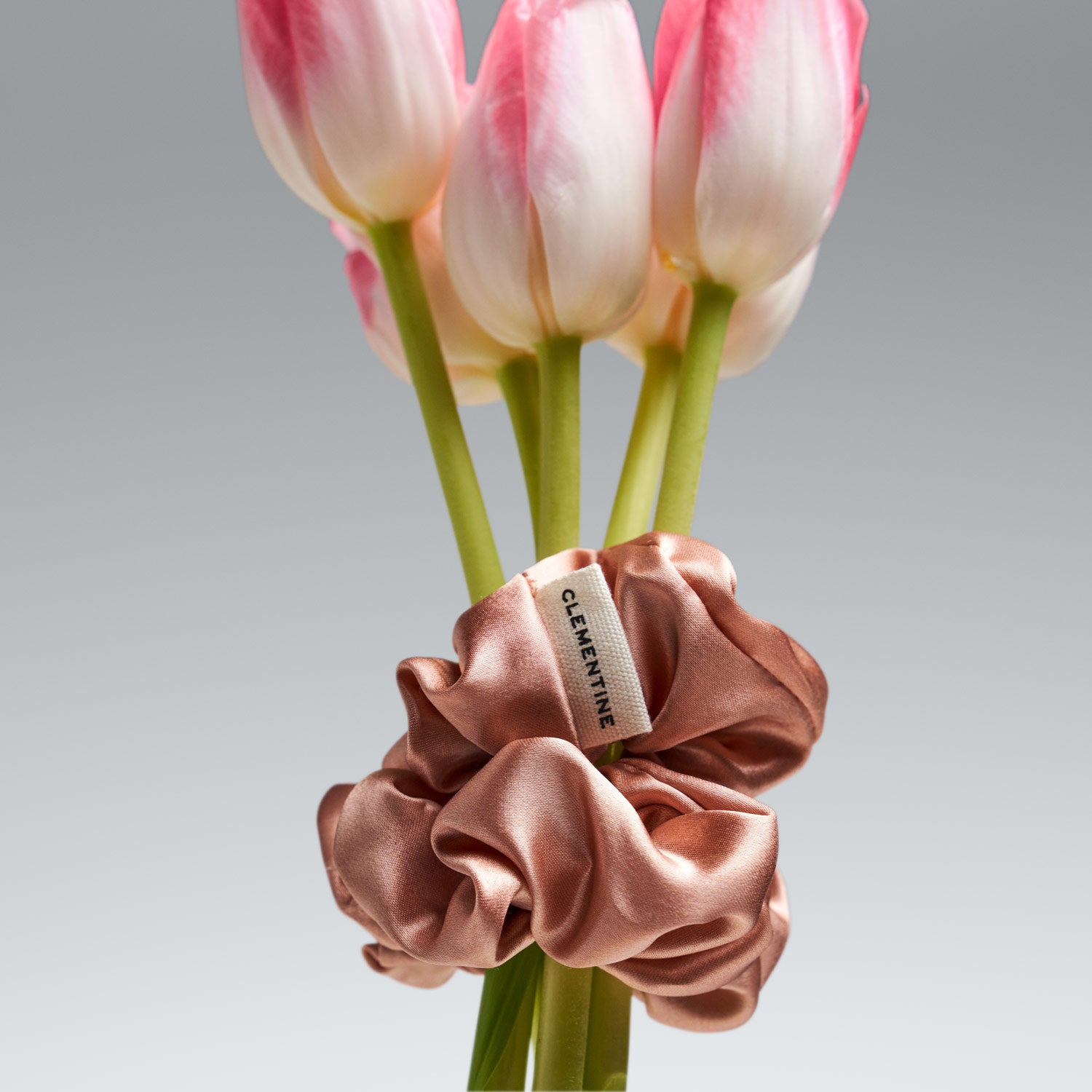 organic peach scrunchie on tulip close up