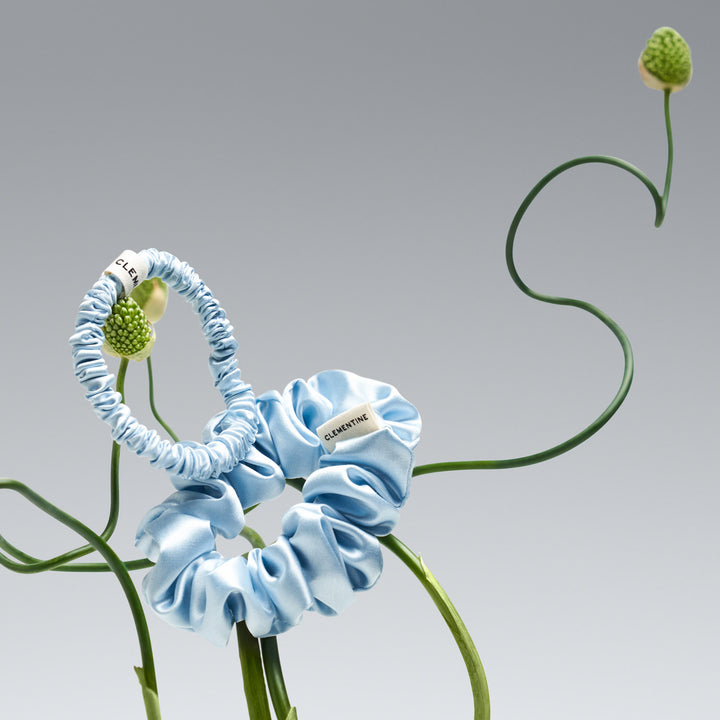 blue scrunchies on flower stems in silk