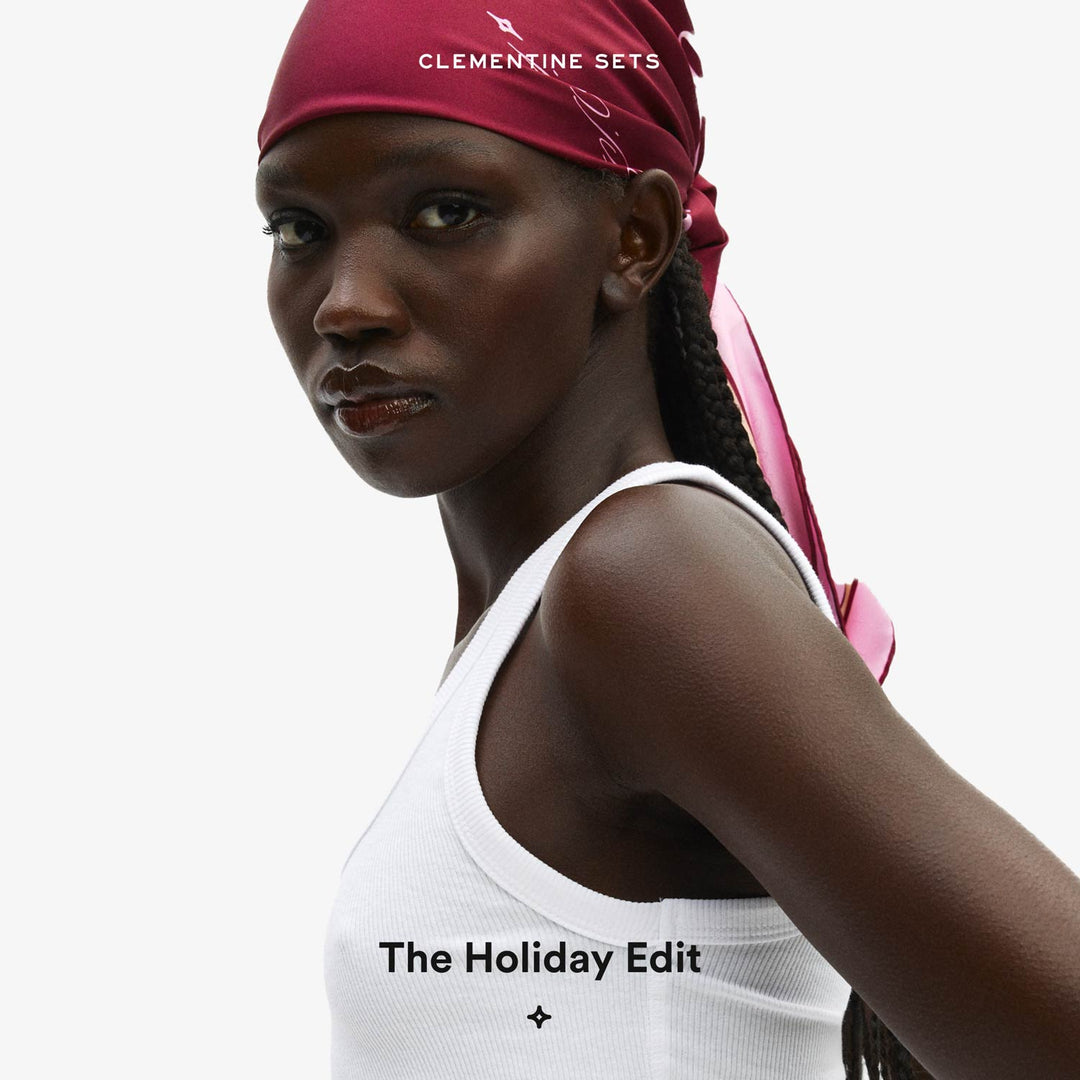 Close-up portrait of a woman wearing a pink headscarf and white tank top; text reads CLEMENTINE SETS and The Holiday Edit.