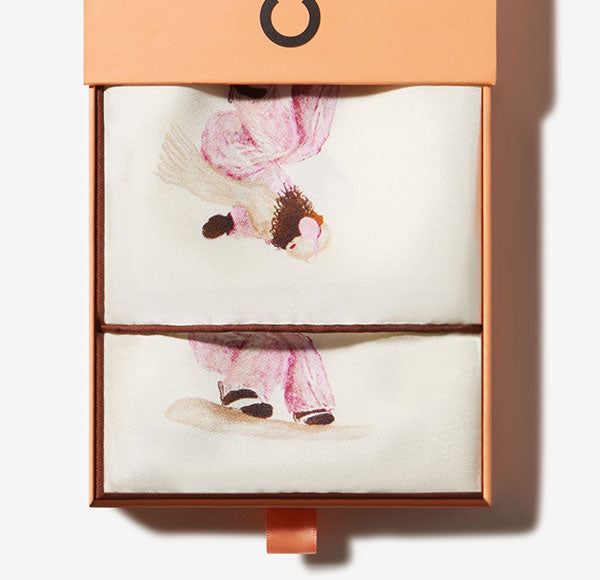 Silk scarf set with pink watercolor ballet-dancer illustration packaged in a peach slide-out gift box.
