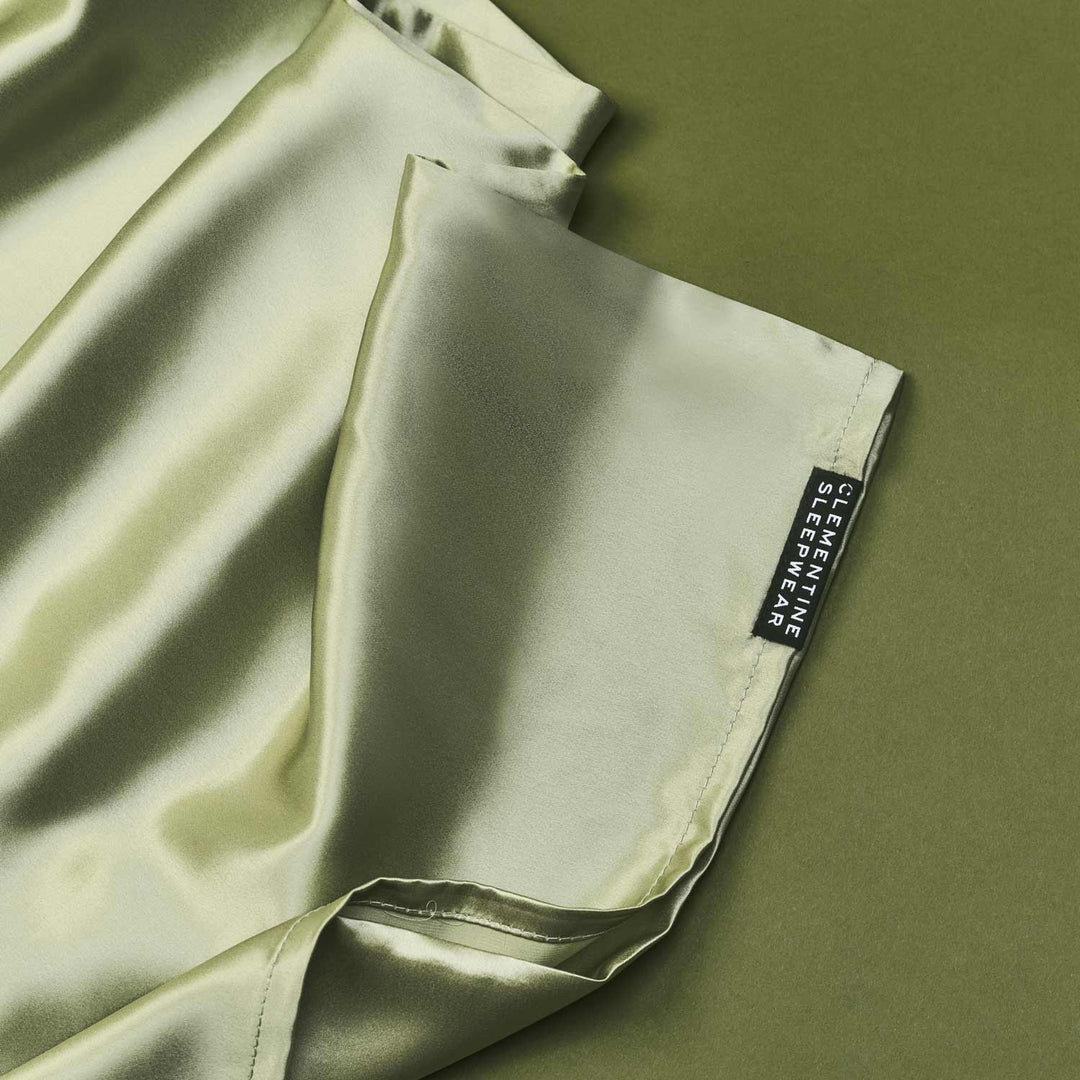 Light green fabric with a Clementine brand label on a matching background in silk. 