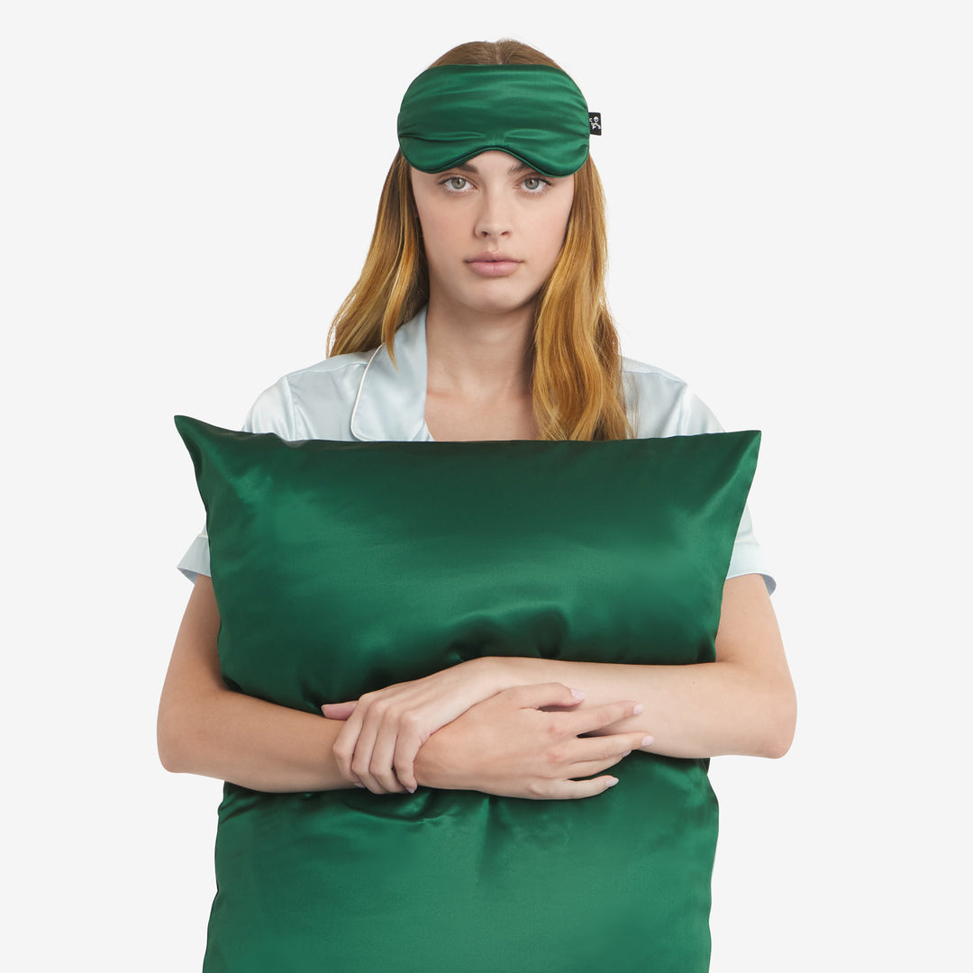 Holding pillowcase front with mask#color_forest-green
