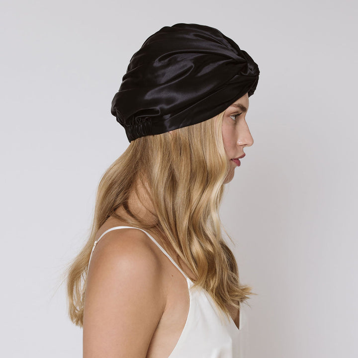 black hair bonnet blond model side view#color_black