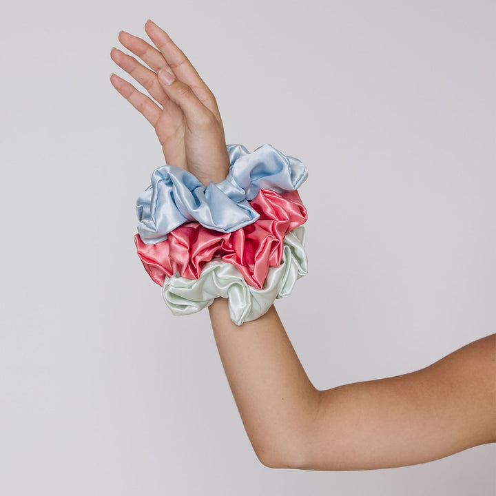 Extra large oversized scrunchies in organic silk on hands