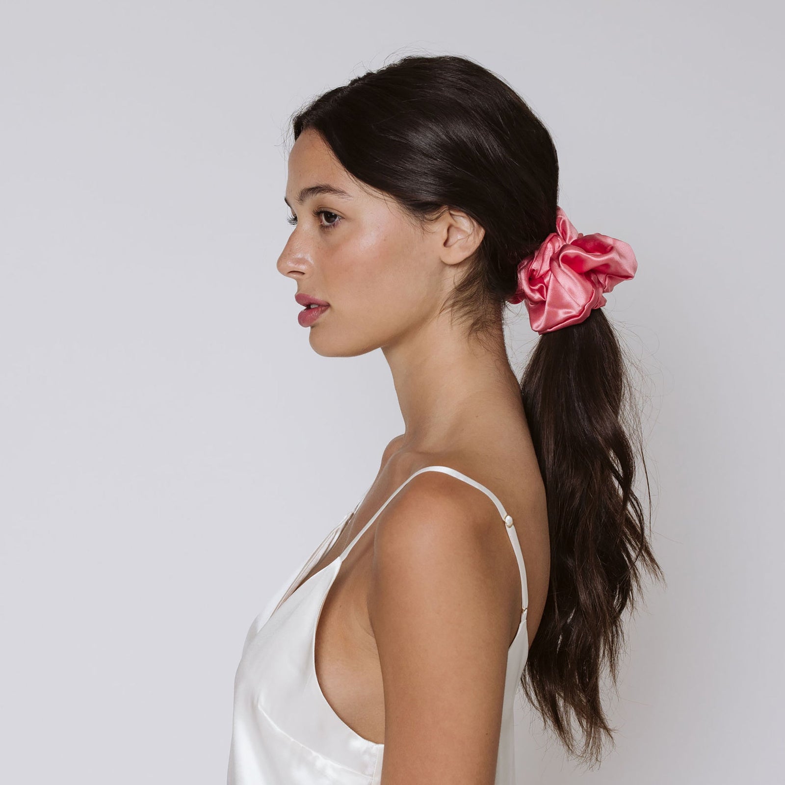 Blush pink oversized scrunchie in organic silk in brunette hair